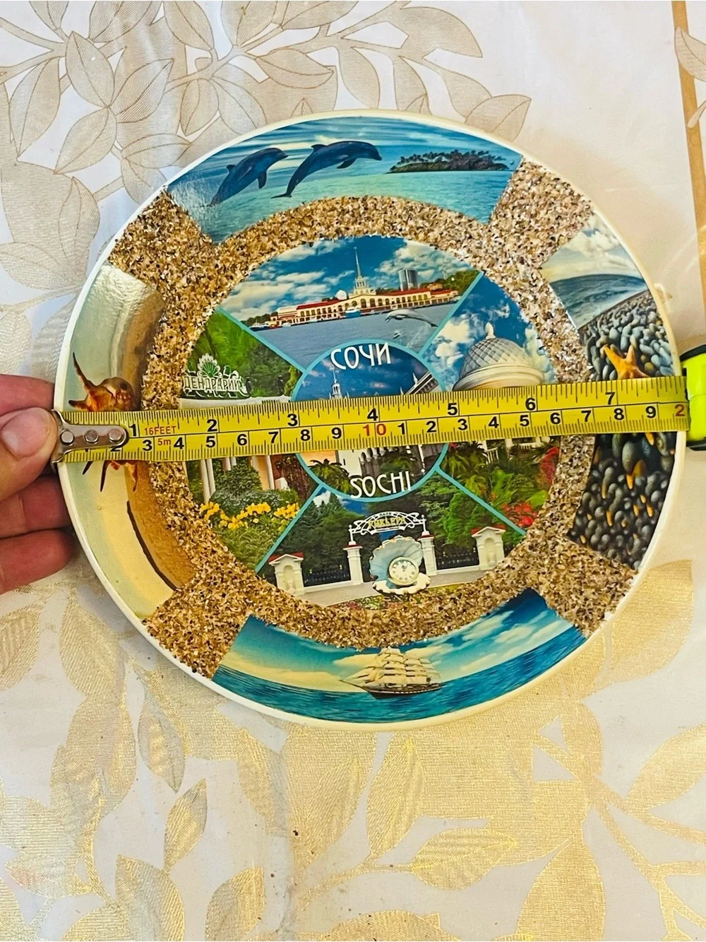 VTG decorative ceramic souvenir plate featuring scenes of Sochi, Russia.